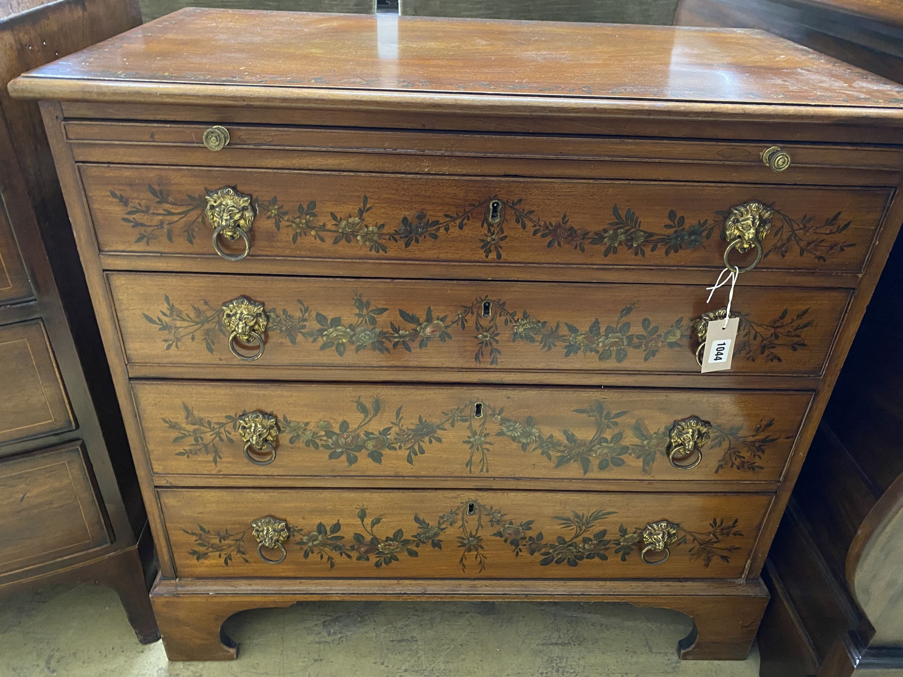 An early 20th century floral painted mahogany chest of drawers, fitted slide, width 90cm, depth 51cm, height 86cm